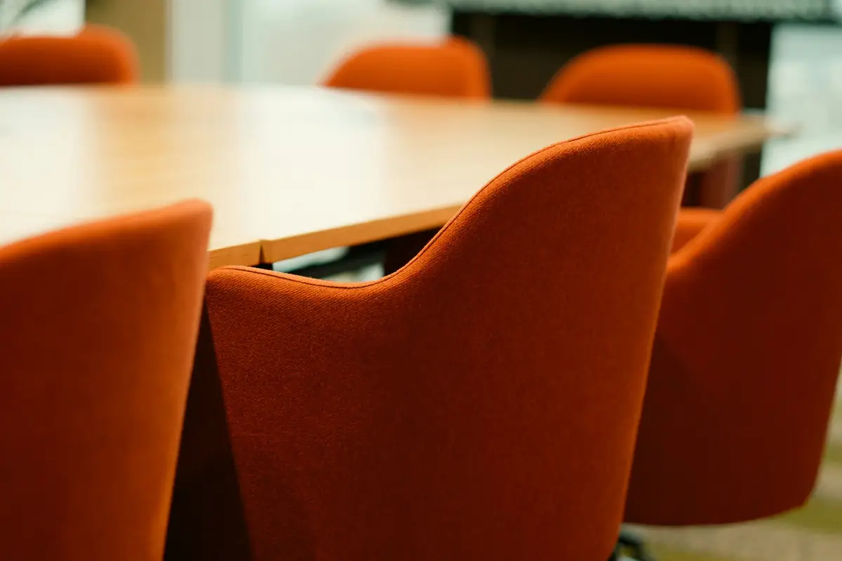 Chairs around a wooden conference table